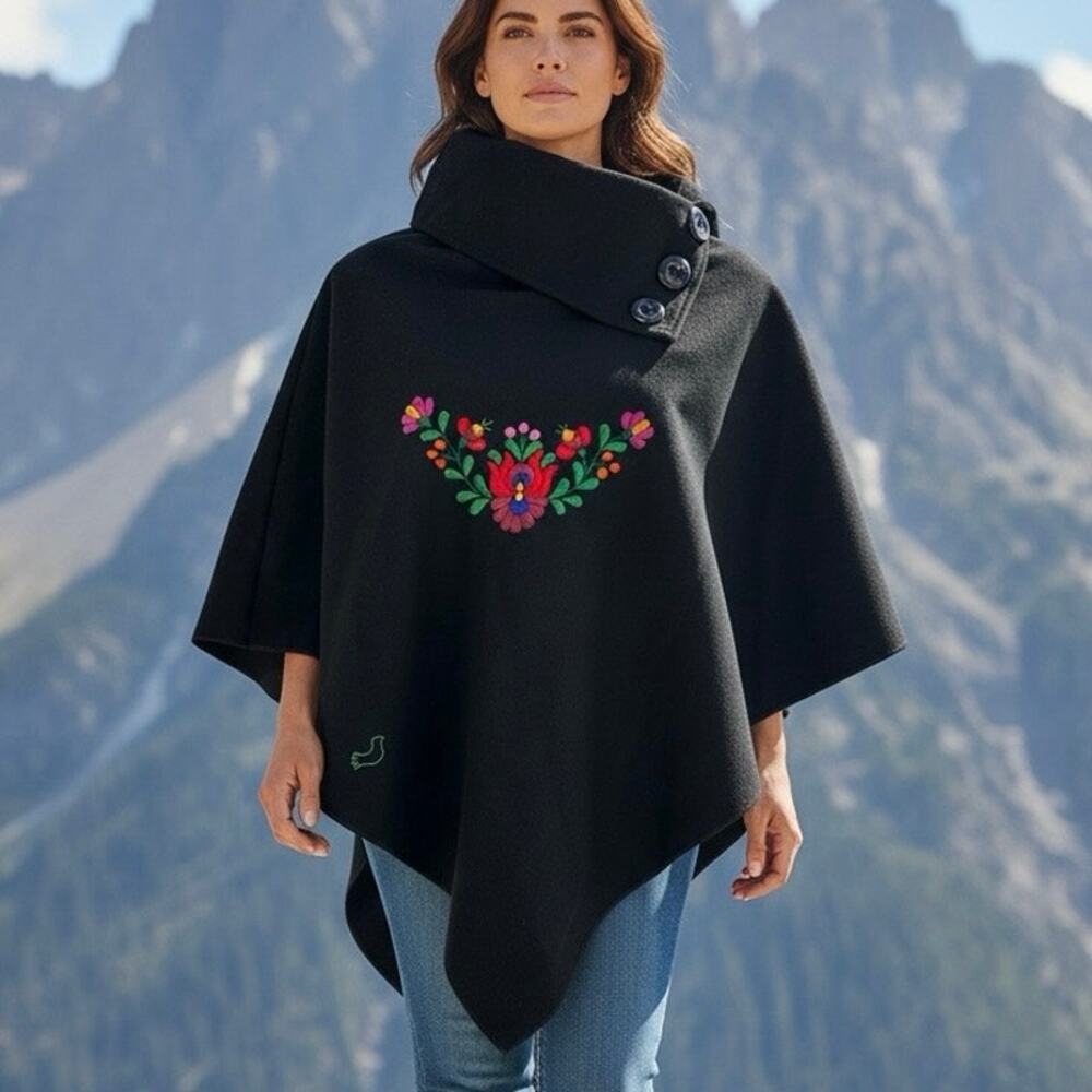 Matyodesign black cowl-neck poncho featuring vibrant, colorful floral embroidery